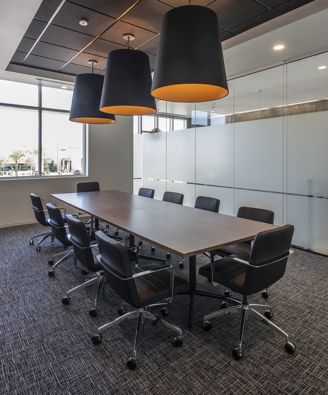 Modern conference room with statement pendant lighting